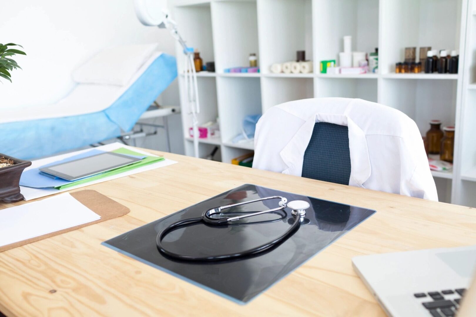 A stethoscope on top of a desk.